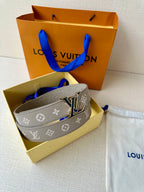 Gray monogram belt in yellow box, LV buckle and blue-tinted strap end