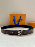 Brown monogram belt with silver-tone LV buckle and blue tassel accents.