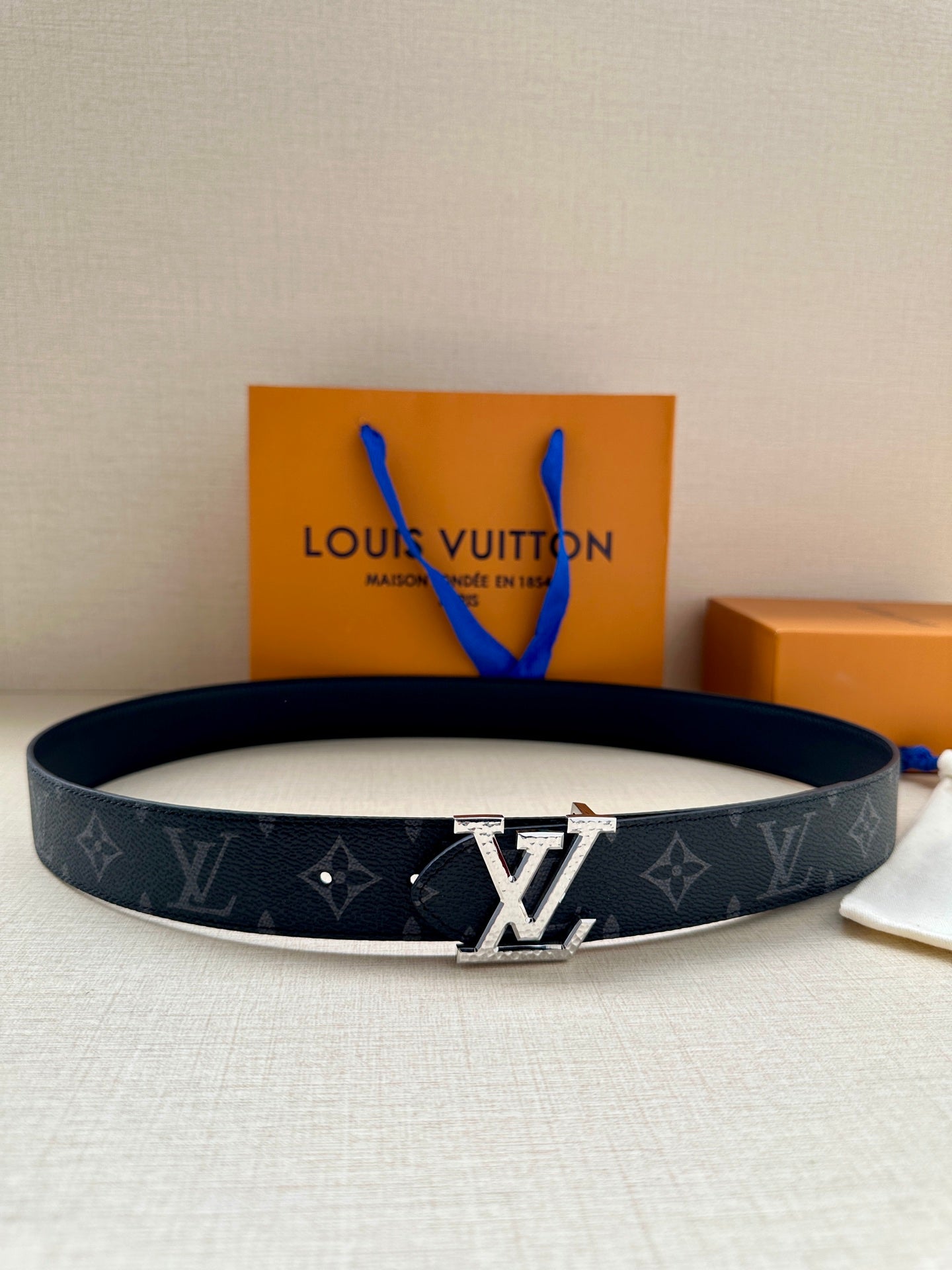 Louis Vuitton belt with dark monogram canvas and silver LV buckle