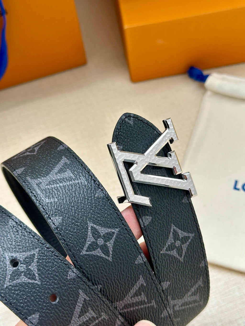 Louis Vuitton belt with dark monogram canvas and silver buckle detail