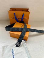 Louis Vuitton belt with dark monogram canvas and gold LV buckle