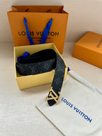 Louis Vuitton belt with dark monogram print and gold-tone LV buckle