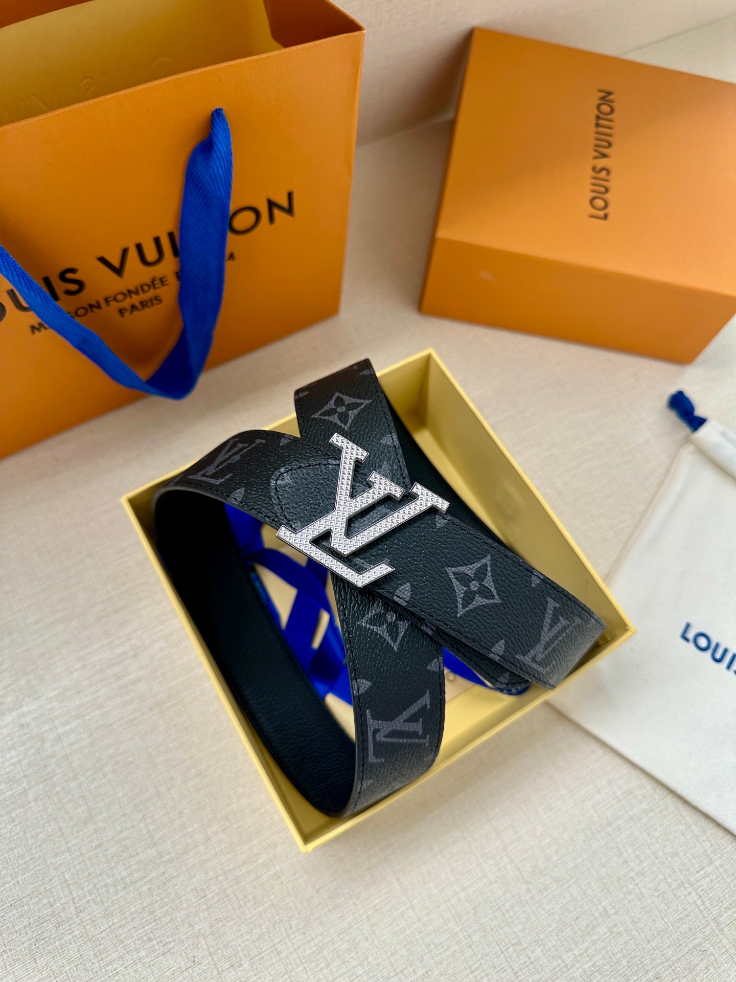 Louis Vuitton belt in dark monogram canvas, gold-tone LV buckle with strap end