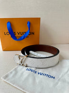White monogram belt with gold-tone LV buckle and dark brown inner leather