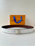 White monogram belt with gold-tone LV buckle and dark brown leather backing