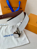 White monogram belt with gold-tone LV buckle and dark brown leather belt end