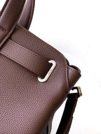 Dior men's brown leather bag with metal D-ring and side strap attachment
