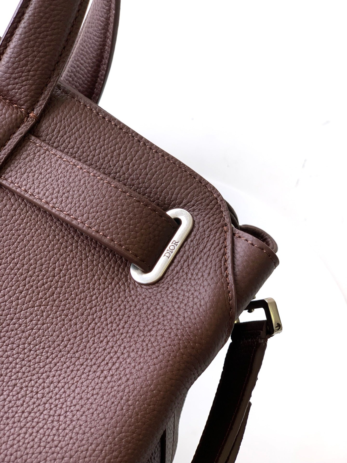 Dior men's brown leather bag with metal D-ring and side strap attachment