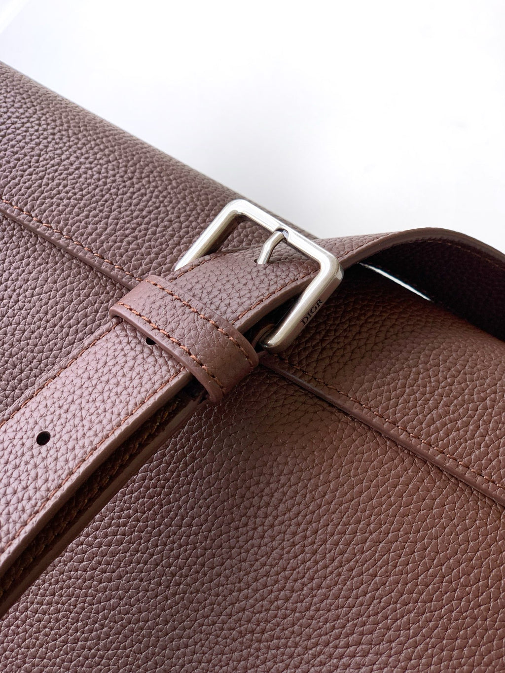 Dior men's brown leather strap with adjustable metal buckle and stitched trim