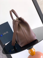 Dior men's brown leather tote bag with long shoulder strap and top handle