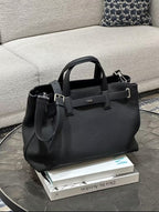 Dior structured tote with top handles, front logo, and detachable side pouch
