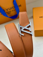 Leather belt buckle, silver LV emblem on brown textured strap.