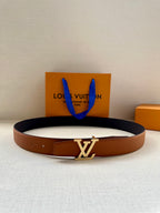 Louis Vuitton leather belt, brown strap with silver LV logo buckle.