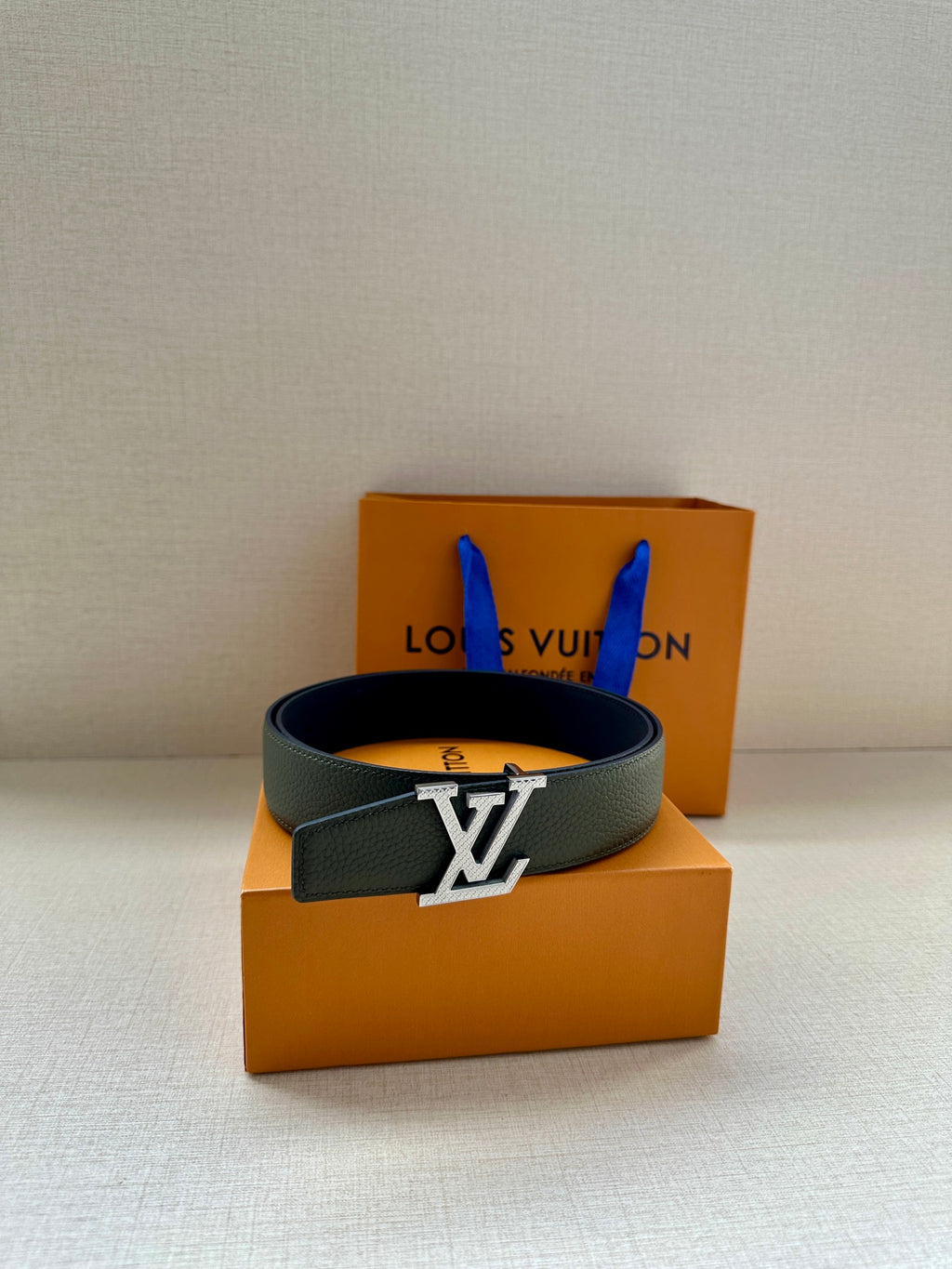 Dark green leather belt with gold LV buckle and matching strap