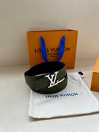 Dark green leather belt with gold LV buckle, laid flat