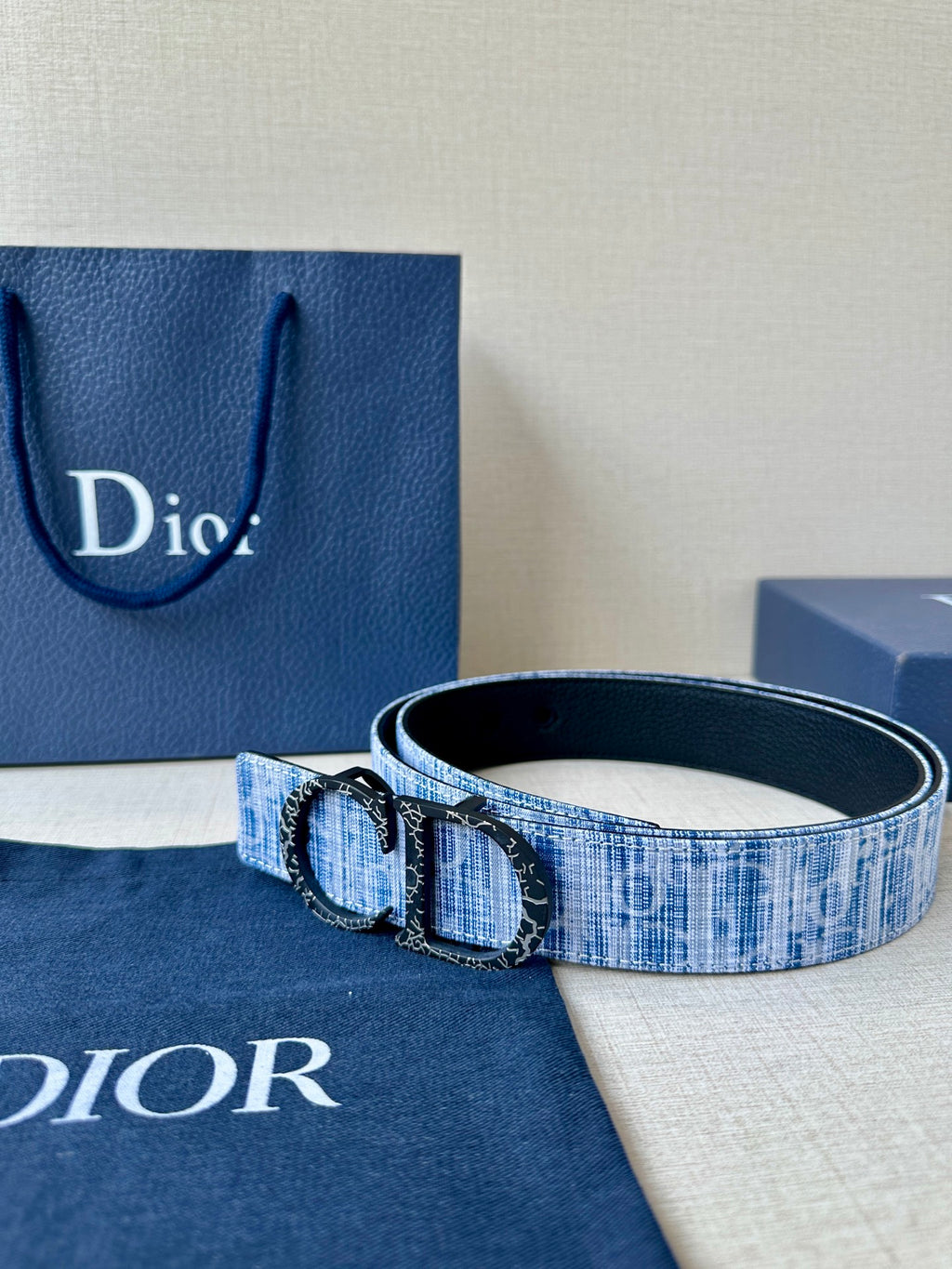 Dior belt with blue patterned strap and metal double-ring buckle