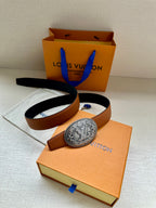 Brown leather belt with silver-tone oval logo buckle and black belt strap