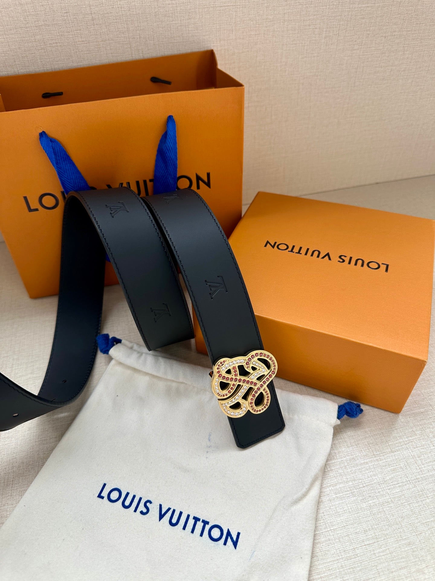 Louis Vuitton dark blue leather belt with rhinestone monogram buckle, folded ends