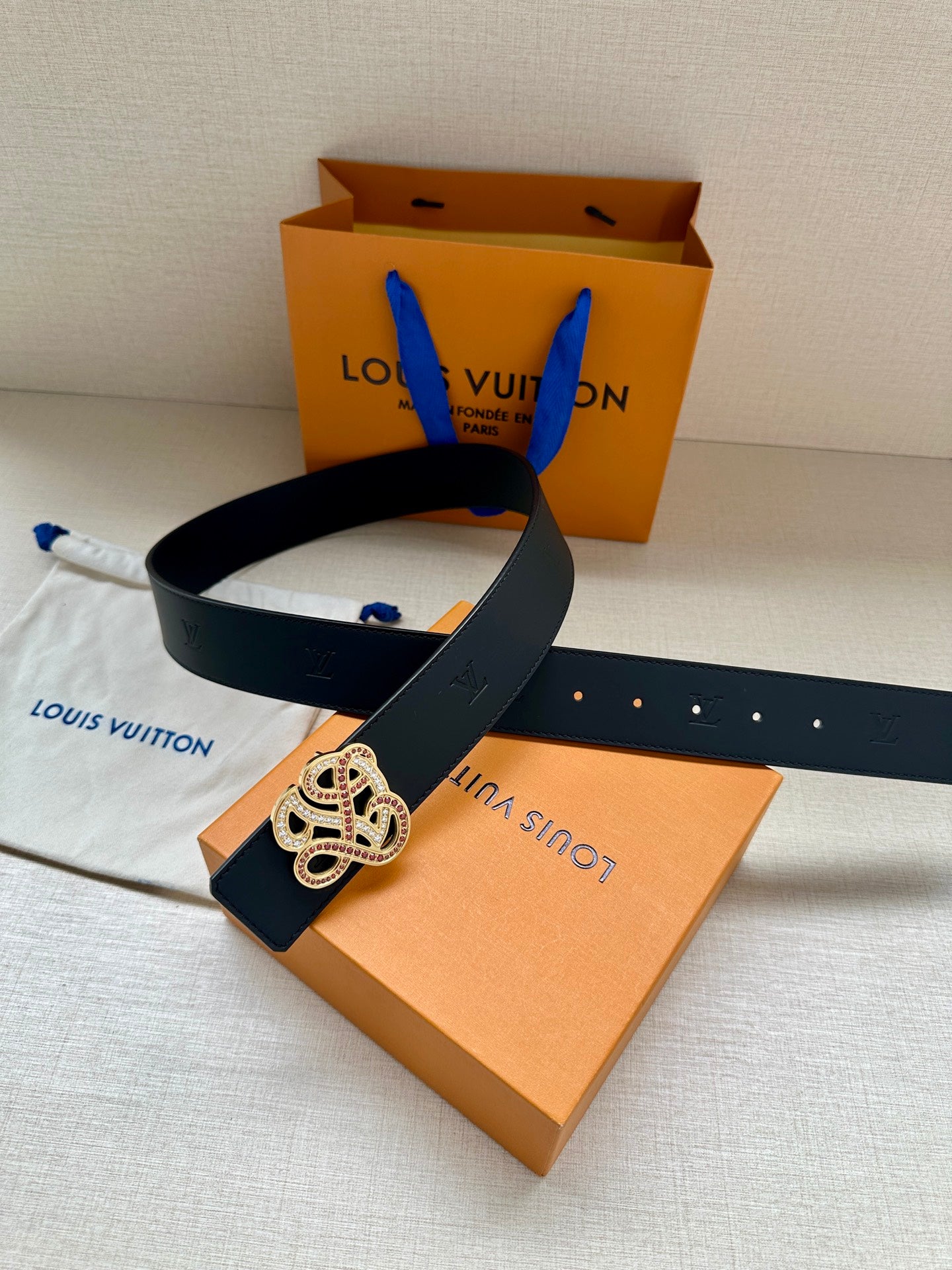 Louis Vuitton dark blue leather belt with rhinestone monogram buckle and punched strap holes