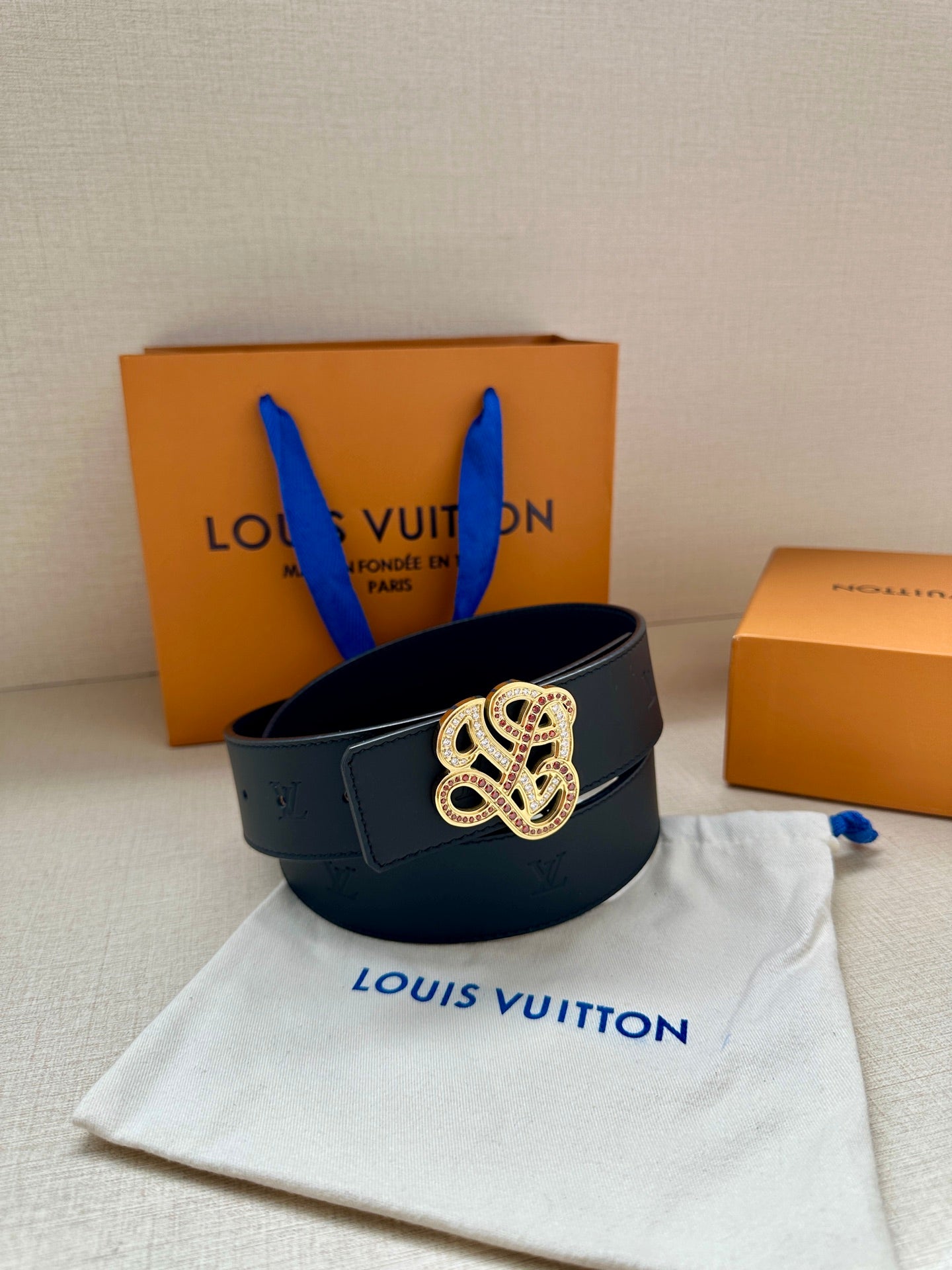 Louis Vuitton dark blue leather belt with gold-tone rhinestone monogram buckle