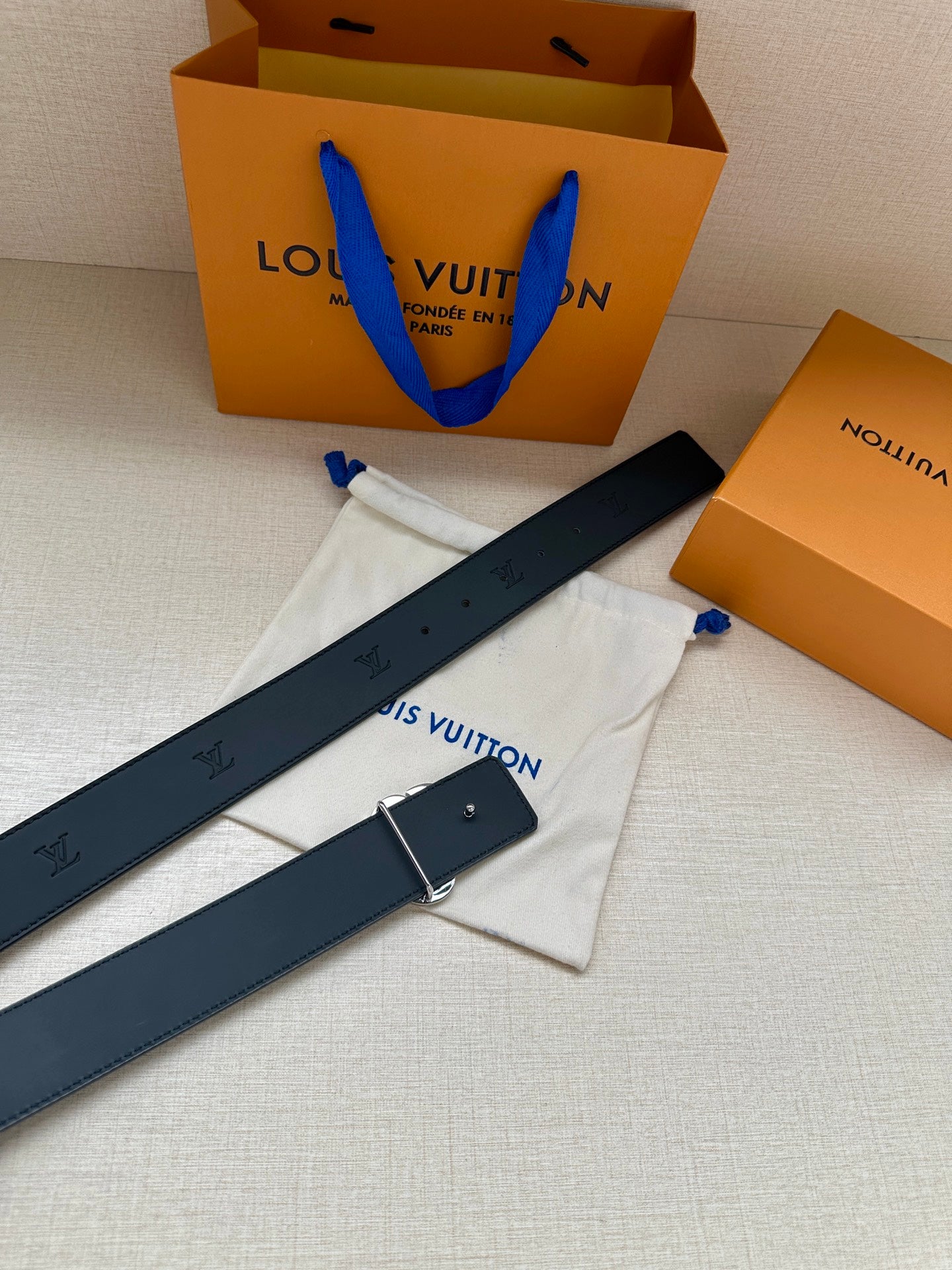 Louis Vuitton dark blue leather belt with rhinestone monogram buckle and strap holes