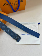 Blue monogram belt strap with dark buckle and punched holes