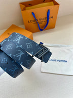 Blue monogram leather belt with dark rectangular buckle close-up