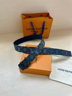 Blue monogram belt with dark buckle, strap laid diagonally