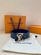 Navy monogram belt with large gold-tone LV buckle on white pouch
