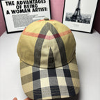 Burberry baseball cap, angled view, yellow check pattern with red trim lines