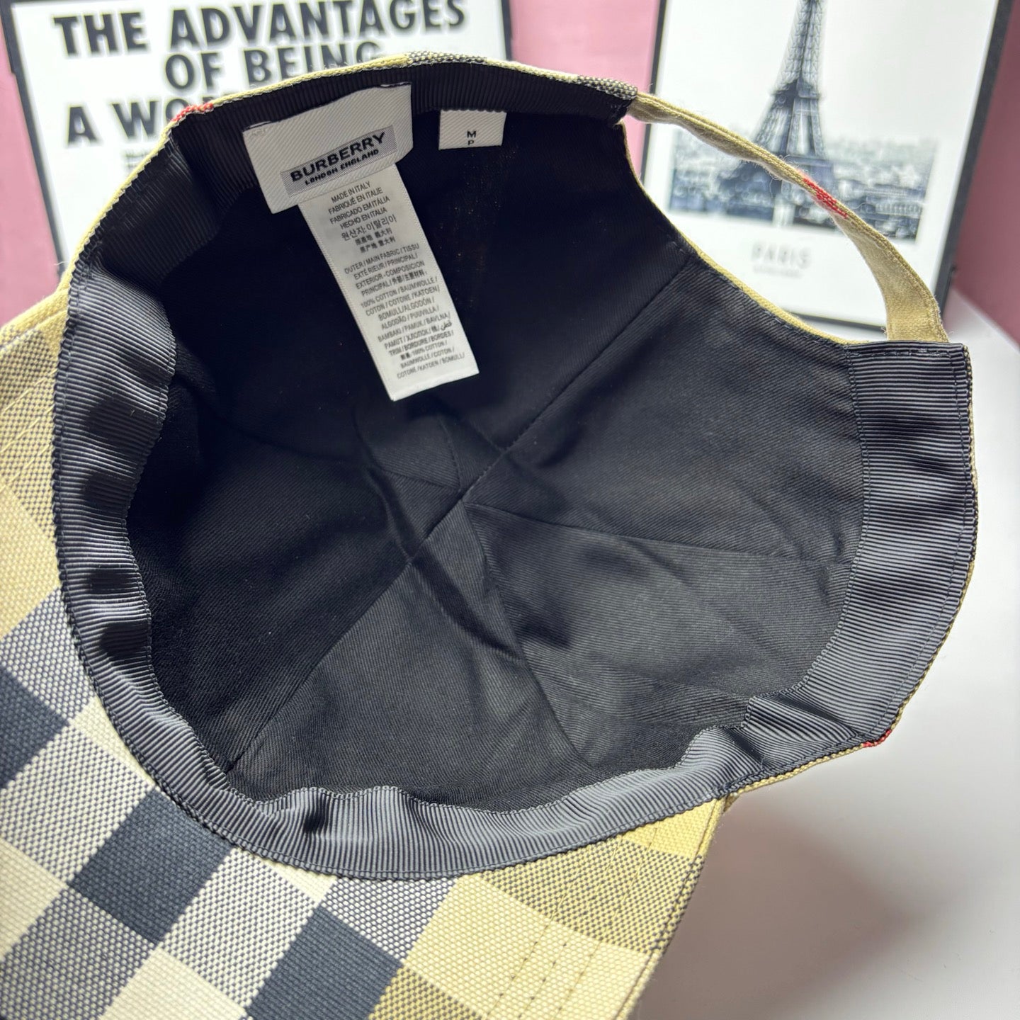 Burberry cap interior lining in dark fabric with size label tag near crown