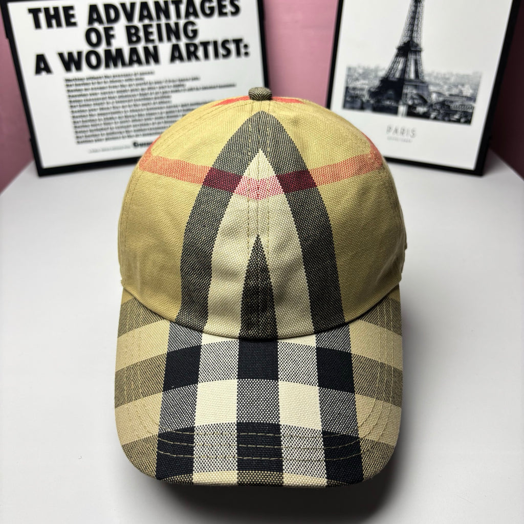 Burberry baseball cap in yellow, black, and red check plaid with curved brim