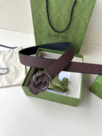 Brown leather belt with silver-tone interlocking G buckle, box display with card