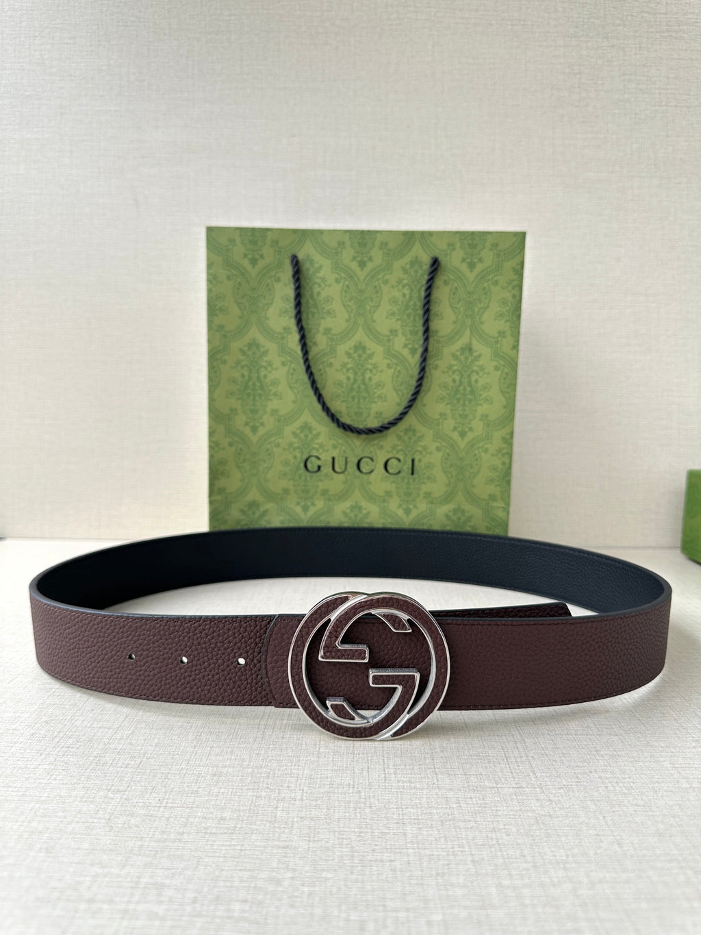 Brown leather belt with silver-tone interlocking G buckle