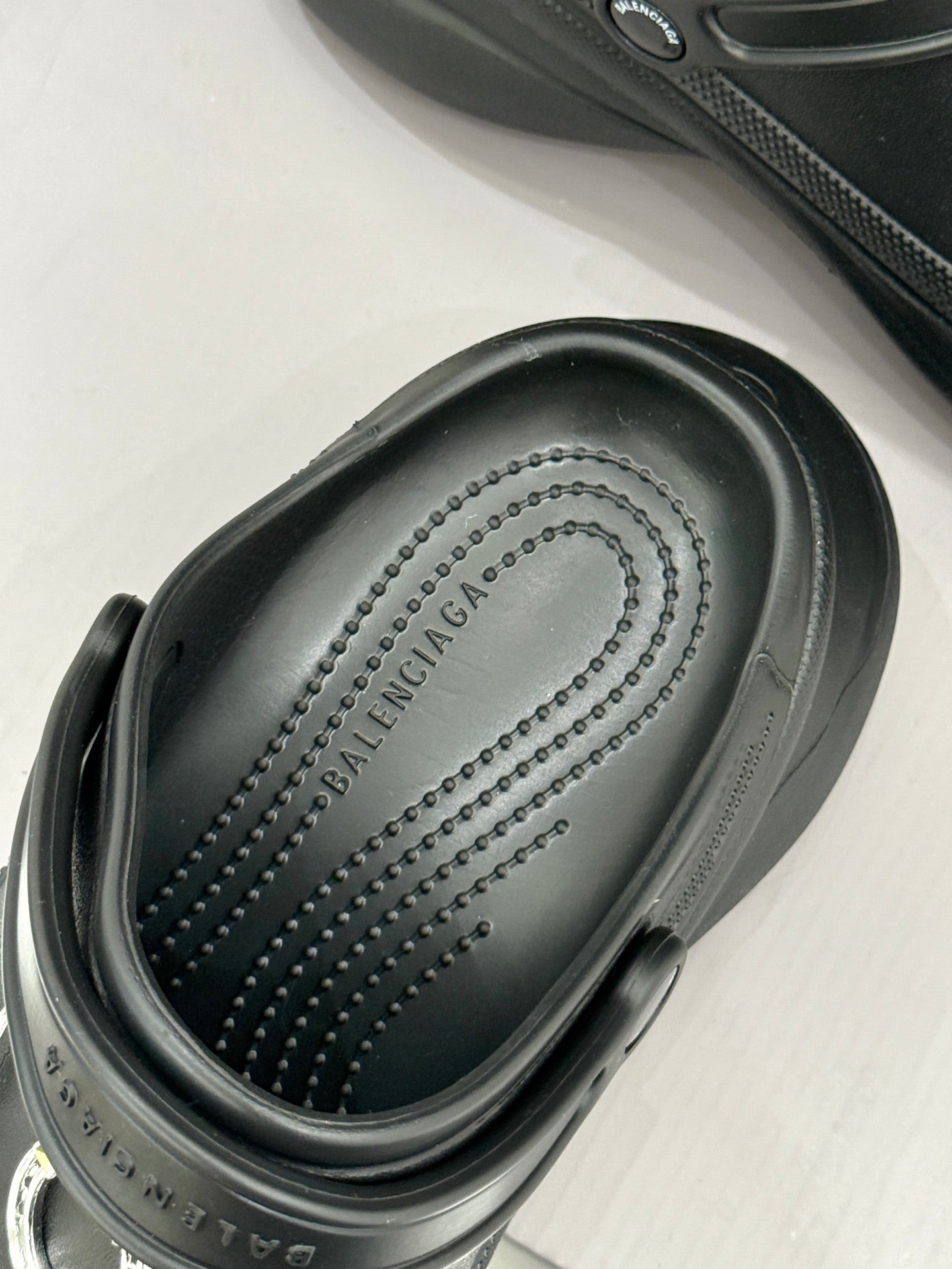Balenciaga black clog with embossed insole texture, close-up