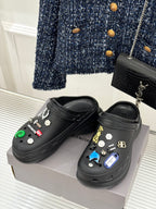 Balenciaga black slip-on clogs with colorful studded decorations, side view