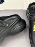 Balenciaga black leather-style slip-on clog, close-up side detail