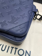 Louis Vuitton men's bag, navy monogram leather detail with stitched corner pocket