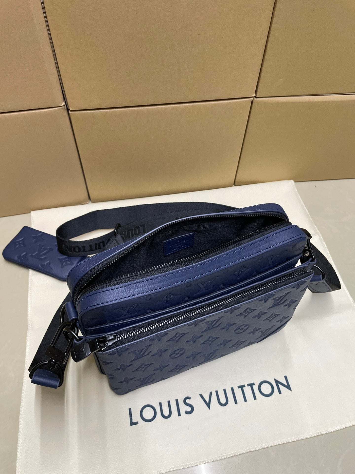 Louis Vuitton men's bag, navy monogram crossbody with adjustable strap and zip closure