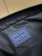 Navy fabric interior pocket with embossed Louis Vuitton label