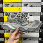 Gray Balenciaga sneaker with lace-up and yellow accents, chunky sole