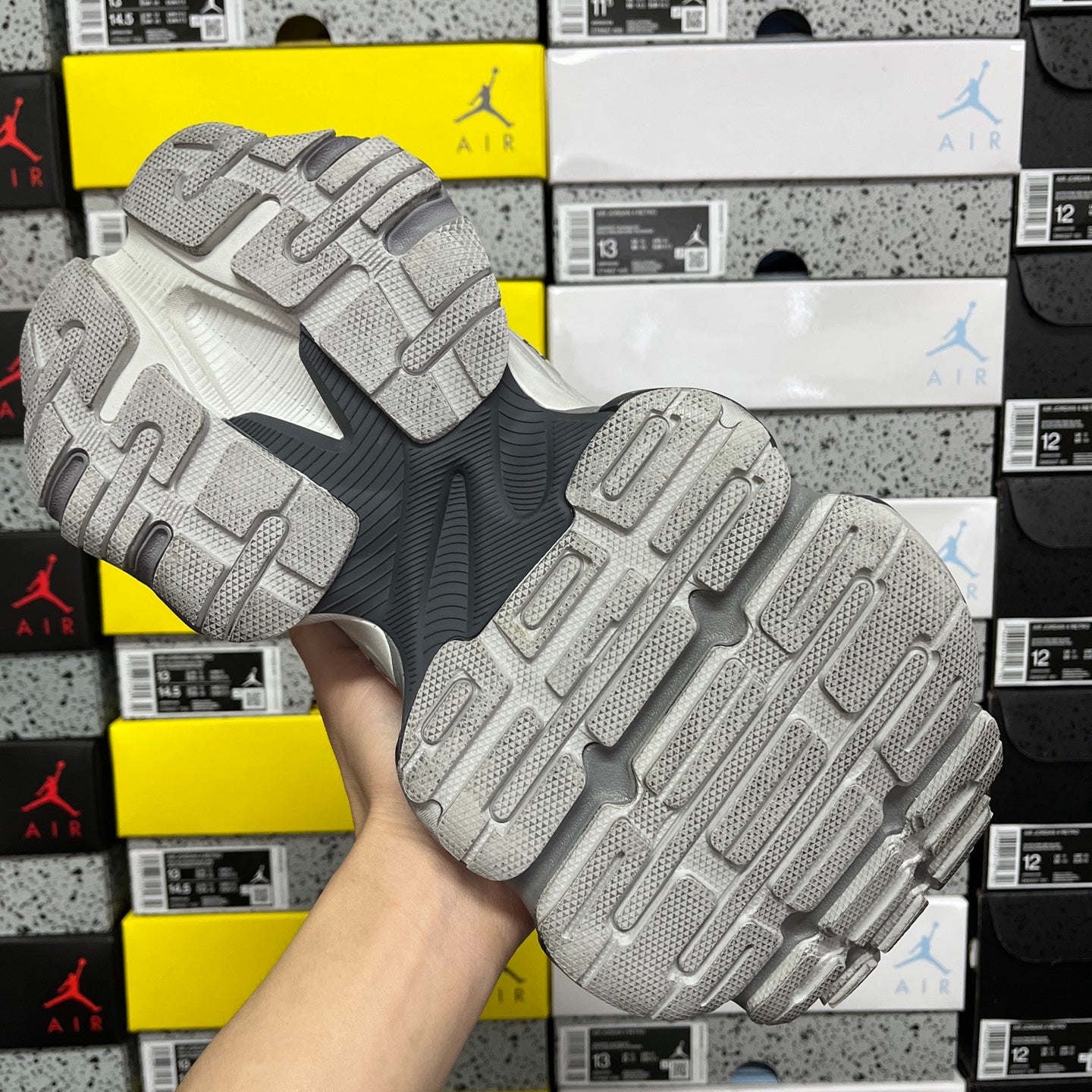 Gray Balenciaga sneaker outsole tread, raised rubber pods with traction pattern