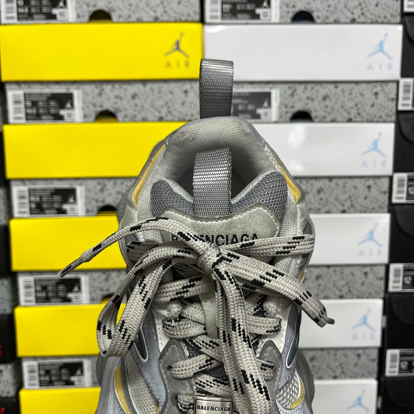 Gray Balenciaga sneaker with BALENCIAGA heel label and braided laces, lace-up