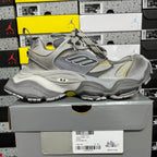 Gray Balenciaga lace-up sneaker with mesh panels and yellow stripe accents, chunky sole