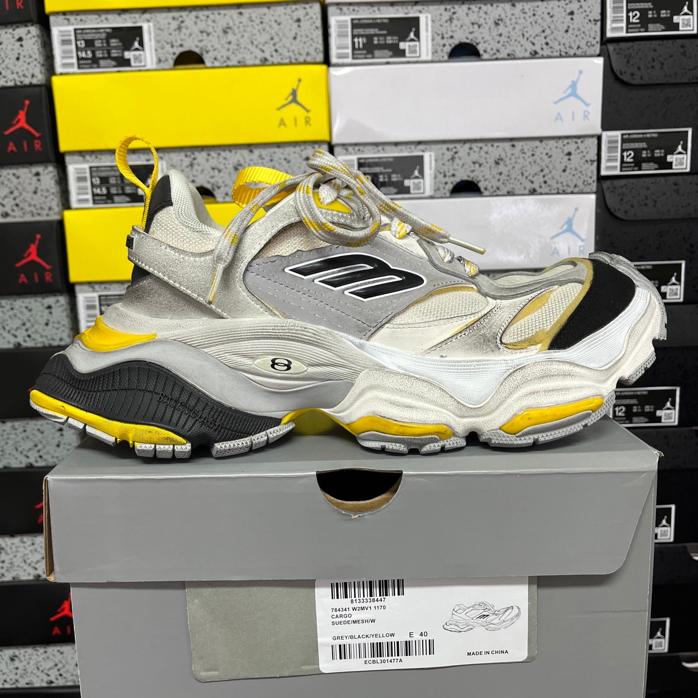 Balenciaga unisex sneakers, light gray uppers with yellow trim, lace-up, side profile