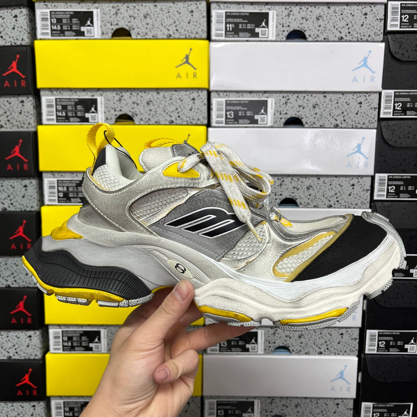 Balenciaga unisex sneakers, light gray upper with black logo panel and yellow side trim