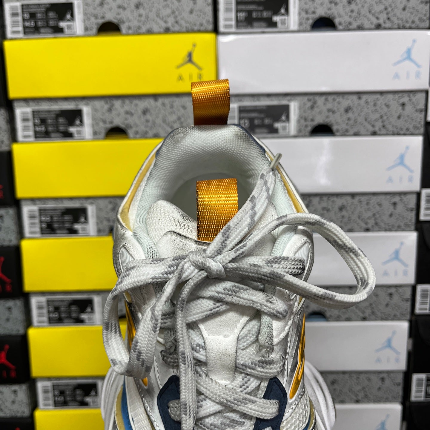 Balenciaga unisex sneaker tongue and lace-up front with gold webbing pull