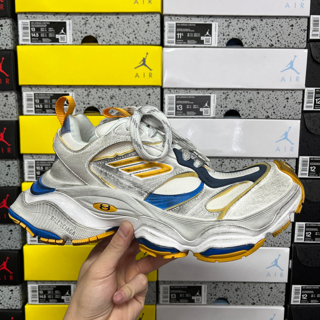Balenciaga unisex sneaker in silver, blue, and gold with lace-up front