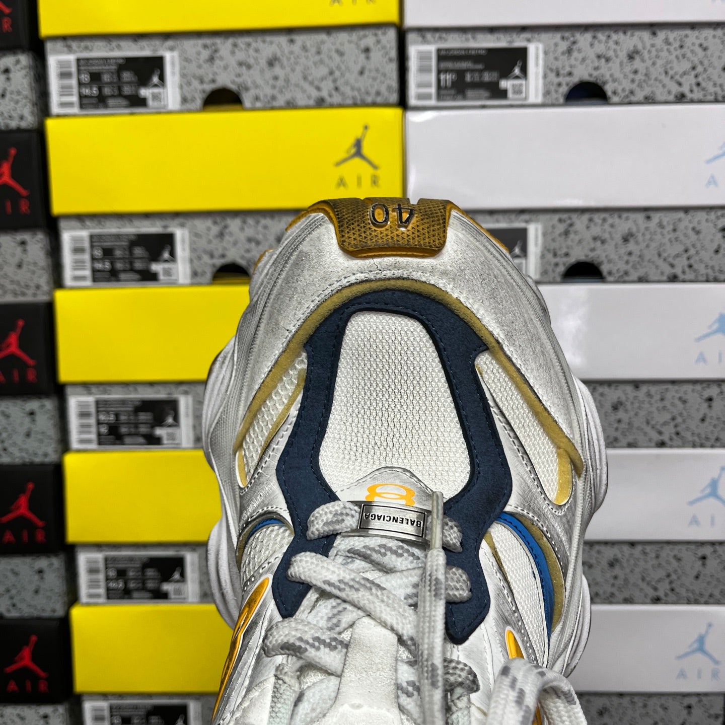 Balenciaga unisex sneaker heel close-up with gold trim and '40' patch