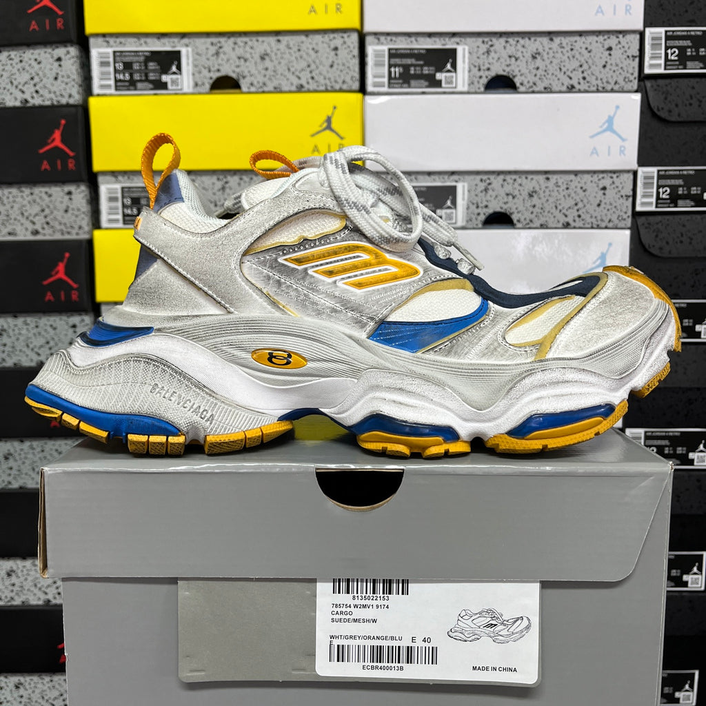 Balenciaga unisex sneaker with lace-up front, silver upper and blue/gold accents